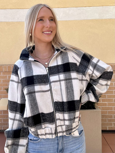AVA LOOKING UPWARDS IN JACKET