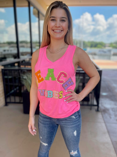JENNA IN BEACH VIBES TANK TOP SAFETY PINK FRONT VIEW SMILING