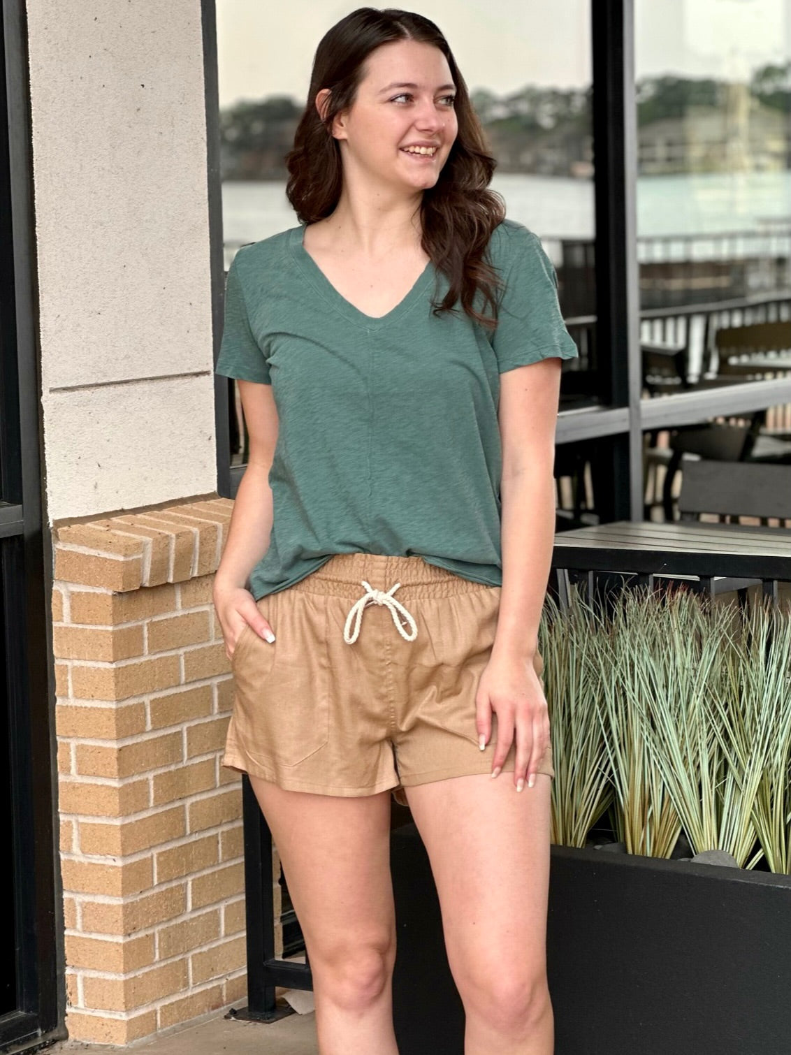 MEGAN LOOKING TO HER RIGHT IN SHORTS