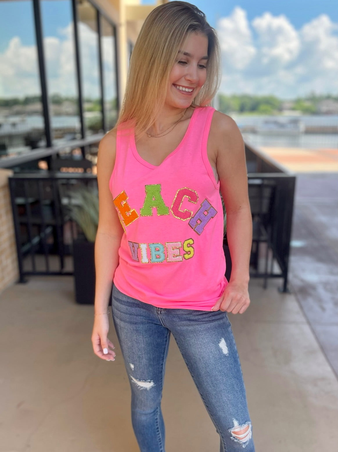 JENNA IN BEACH VIBES TANK TOP SAFETY PINK FRONT VIEW LOOKING DOWN 