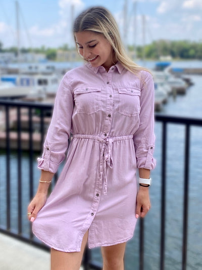 JENNA LOOKING DOWNWARS TO THE LEFT IN DRESS