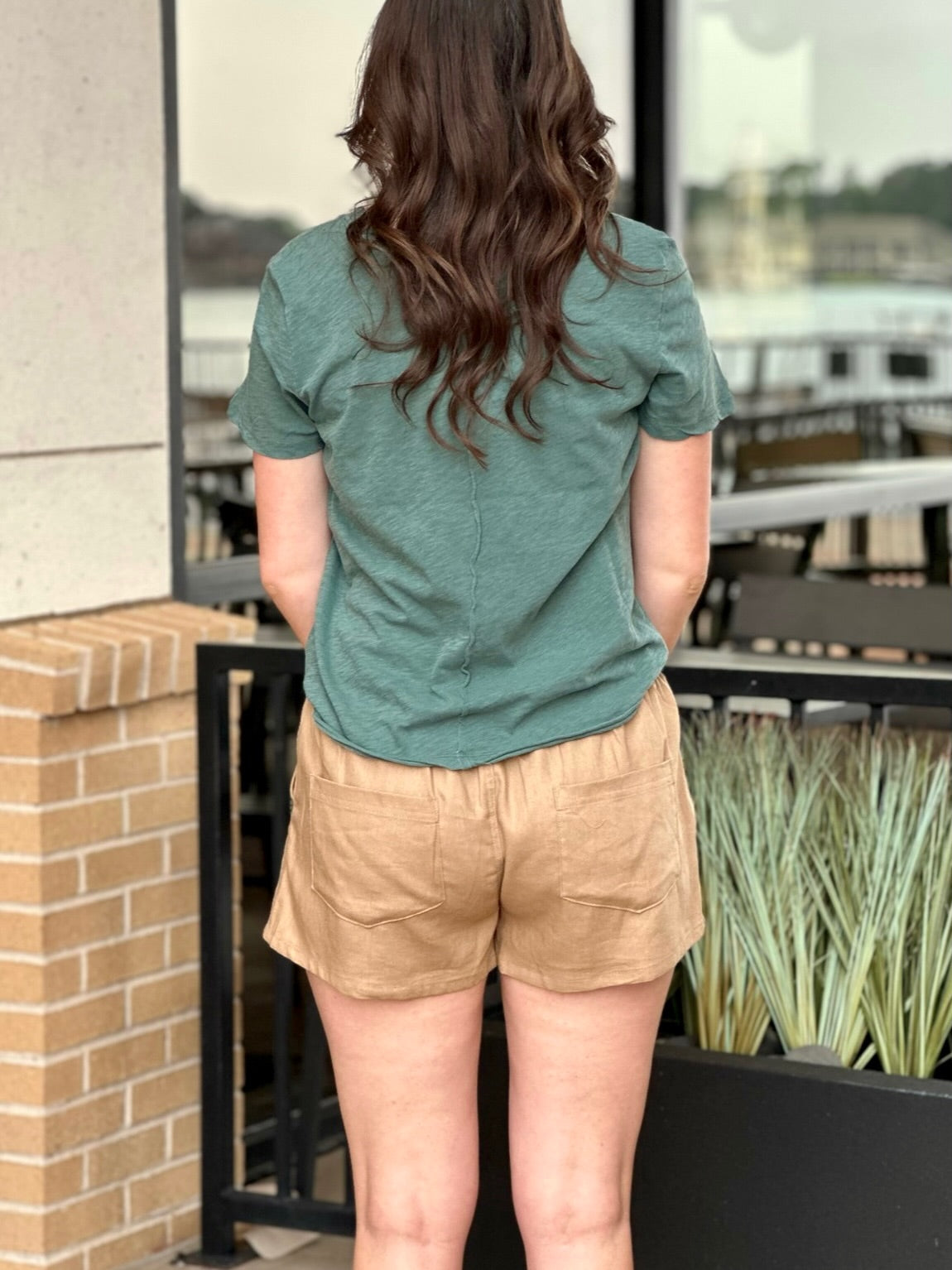 BACK VIEW OF MEGAN  IN SHORTS