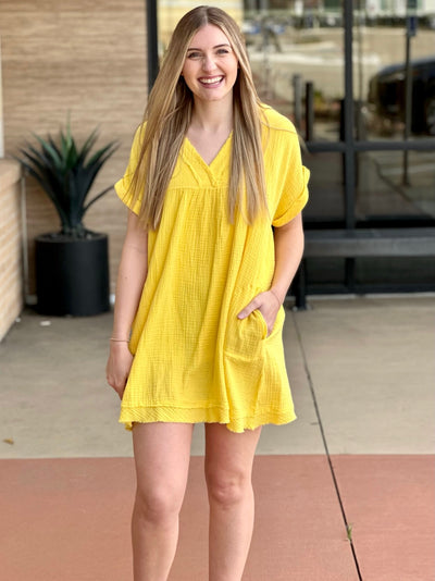 Lexi in yellow dress front view hand in pocket