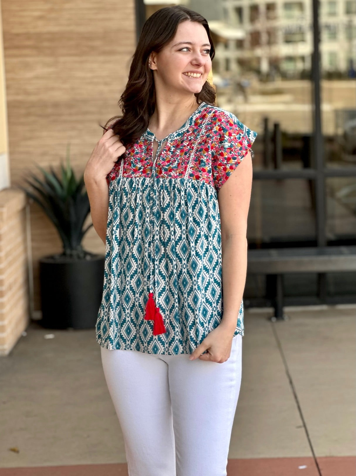 MEGAN IN EMBROIDERED TEAL TOP LOOKING RIGHT
