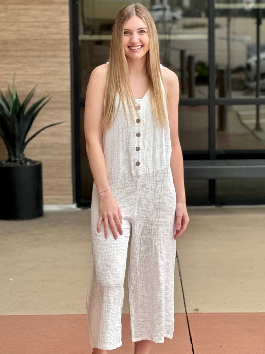 Lexi in off white jumpsuit front view smiling