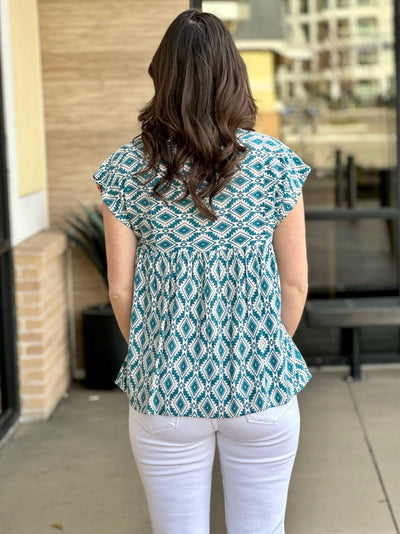 MEGAN IN EMBROIDERED TEAL TOP BACK VIEW