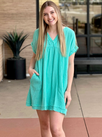 Lexi in mint dress front view looking forward