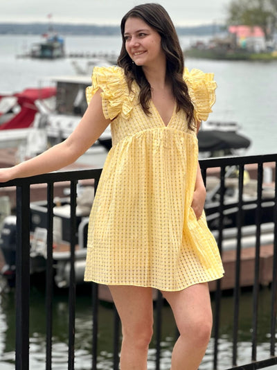 Megan in lemon dress front view hand in pocket