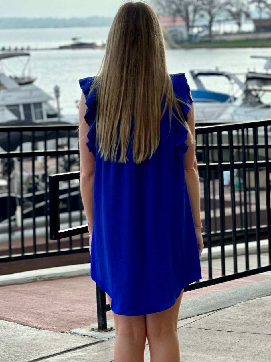 Lexi in cobalt blue dress back view