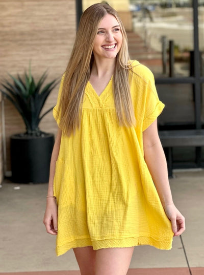 Lexi in yellow dress front view looking to the side