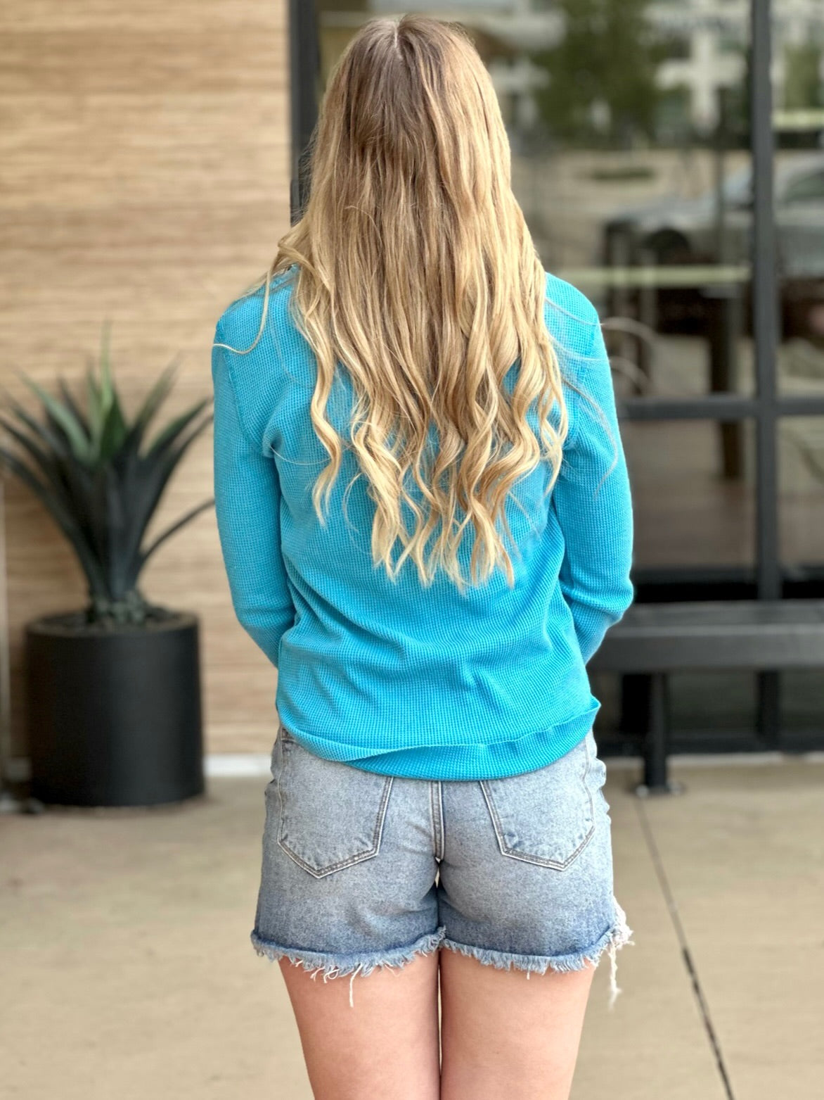 Lexi in turquoise henley back view