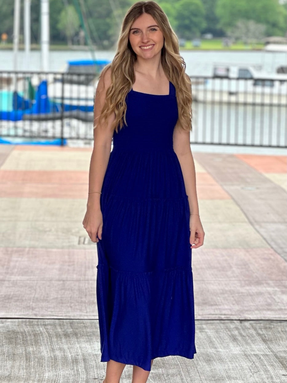 Lexi in bright blue midi dress front view hands down