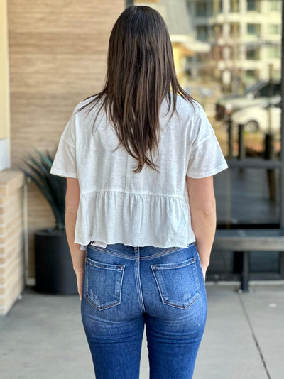 Megan in off white top back view