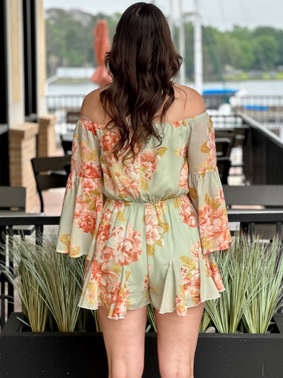 Megan in sage romper back view