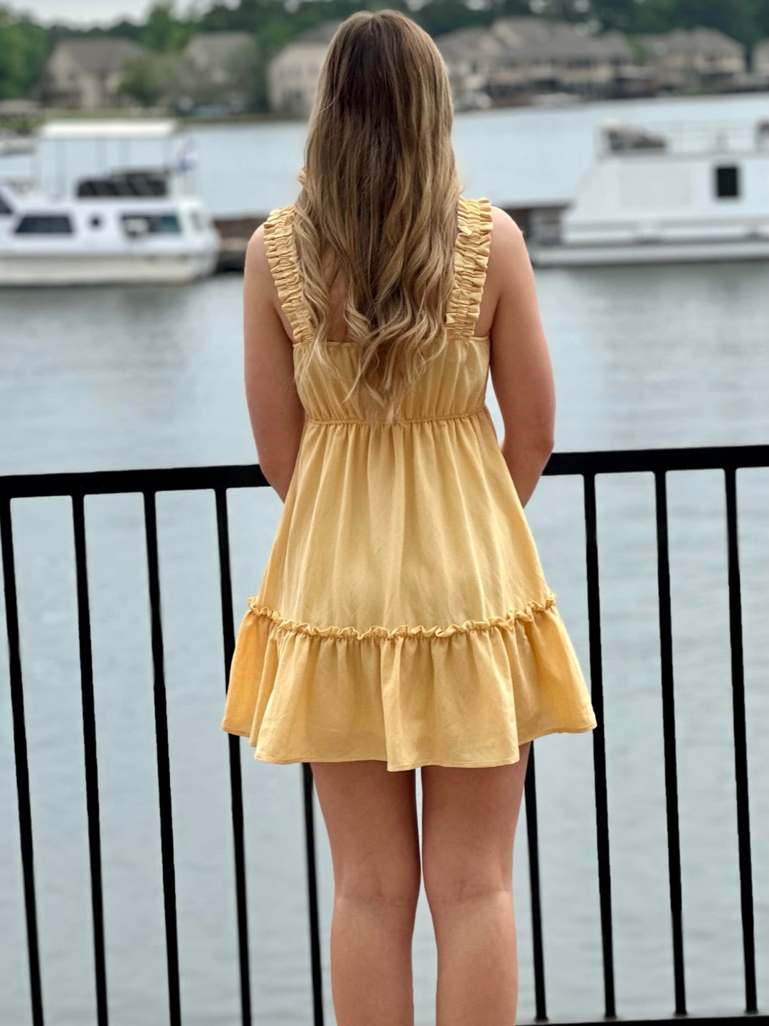 Lexi in yellow dress back view