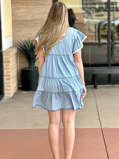Lexi in denim blue dress back view