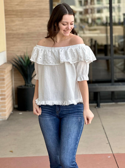 Megan in off white blouse front view smiling