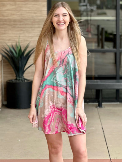 Lexi in pink/green dress front view smiling