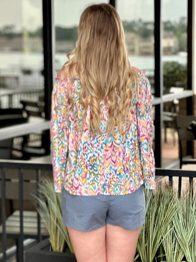 Lexie in multi blouse back view