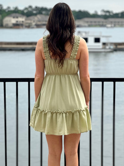 Megan in olive dress back view