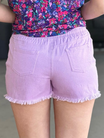 Lexi in lavender shorts back view