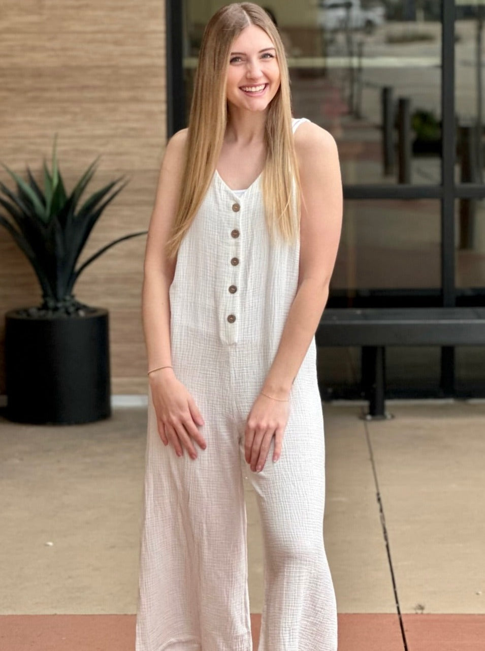 Lexi in off white jumpsuit front view 