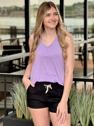 Lexi in taro top looking to the side smiling
