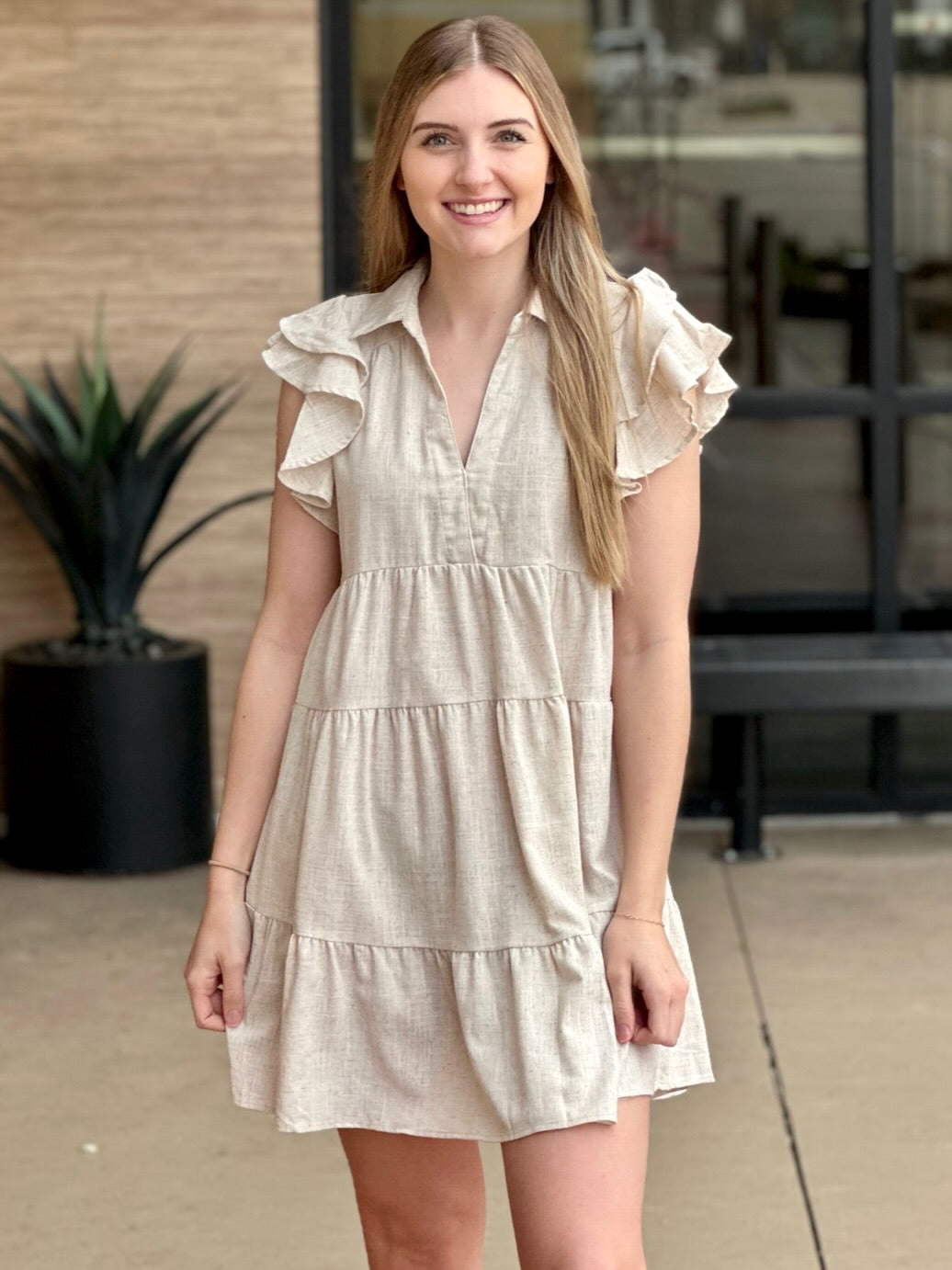Lexi in oatmeal dress front view smiling