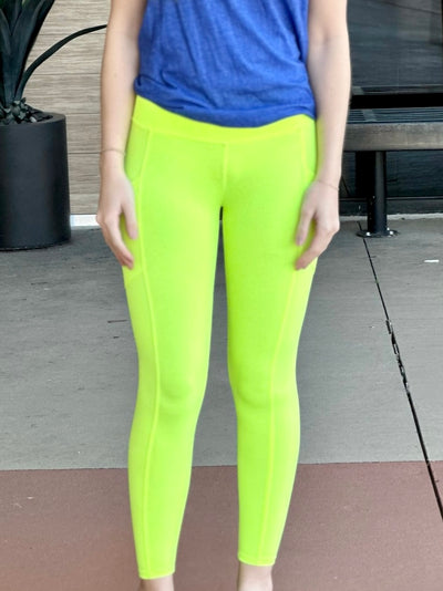 Megan in neon lime leggings front view