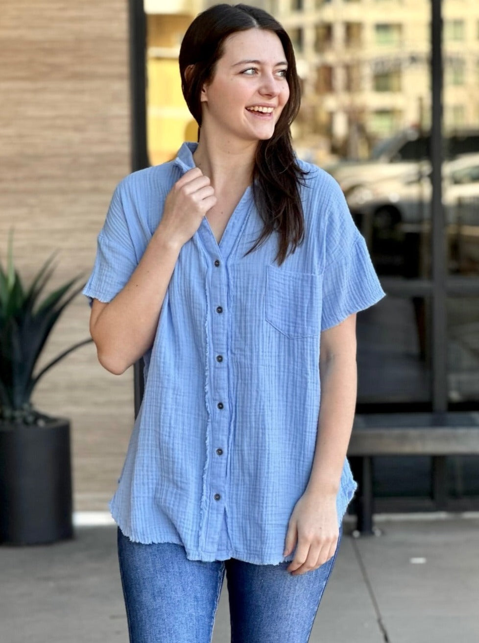 Megan in spring blue shirt front view holding collar