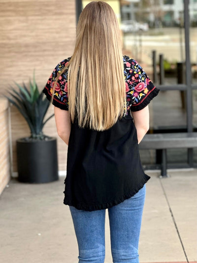 Lexi in black blouse back view