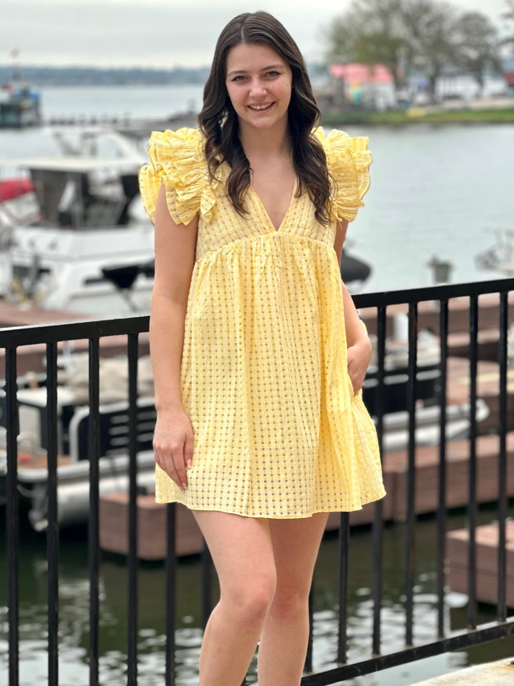 Megan in lemon dress front view smiling