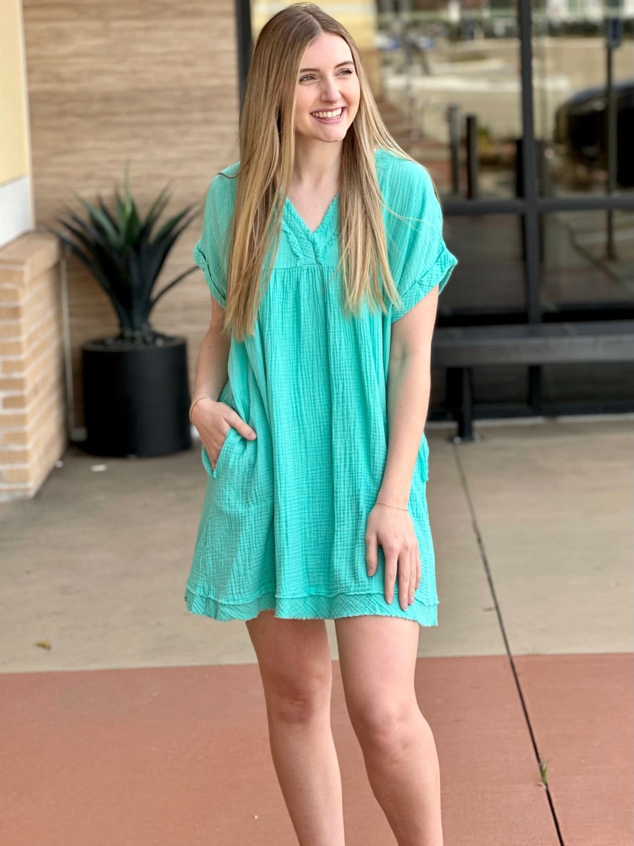 Lexi in mint dress front view looking to the side