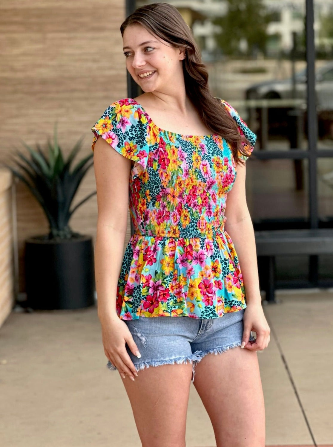 Megan in multi floral blouse front view