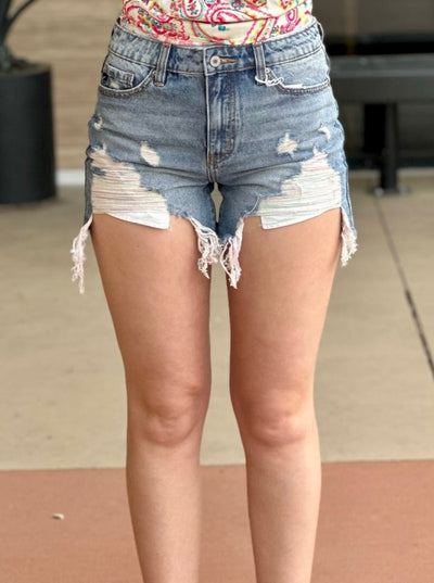 Lexi in medium wash shorts front view