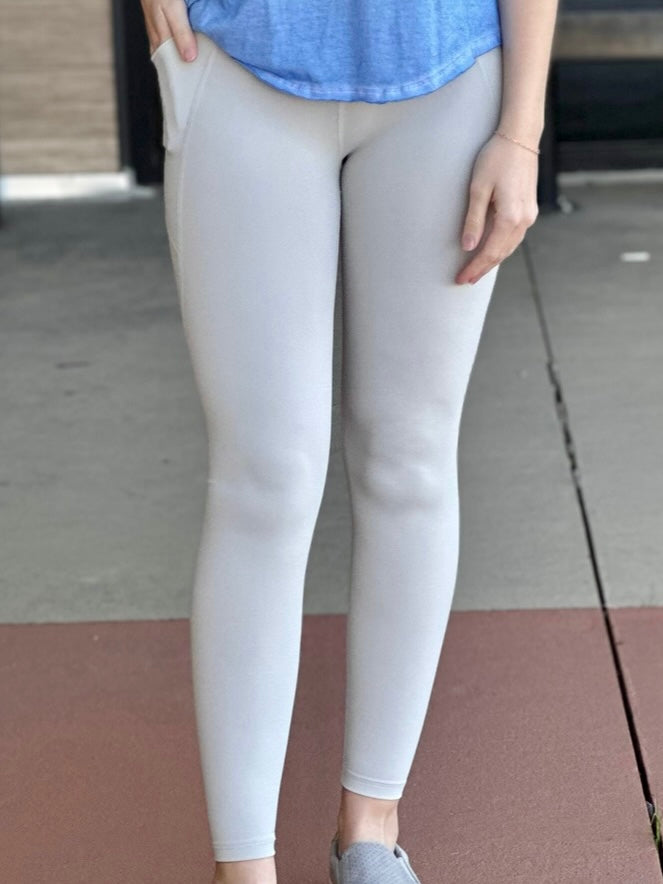 Lexi in light grey leggings front view 