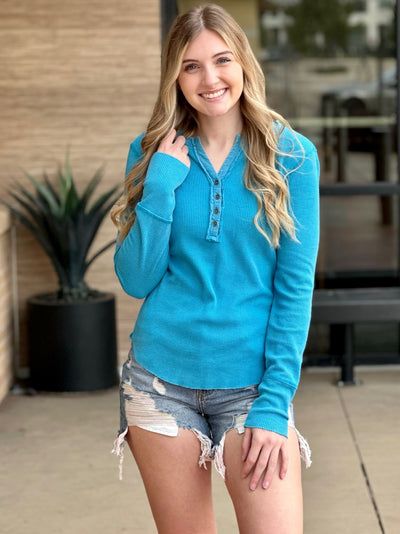 Lexi in turquoise henley hand down