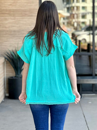 Megan in mint top back view