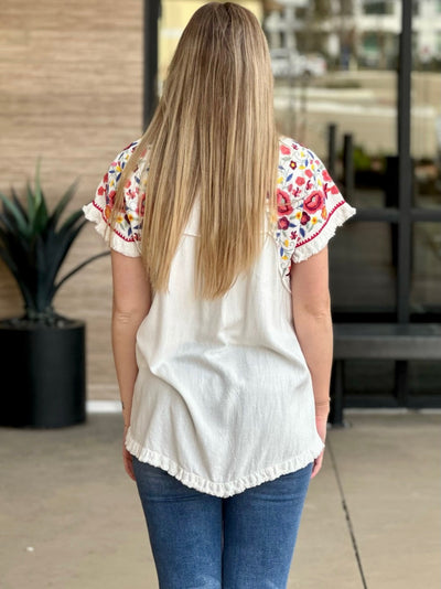 Lexi in off white top back view
