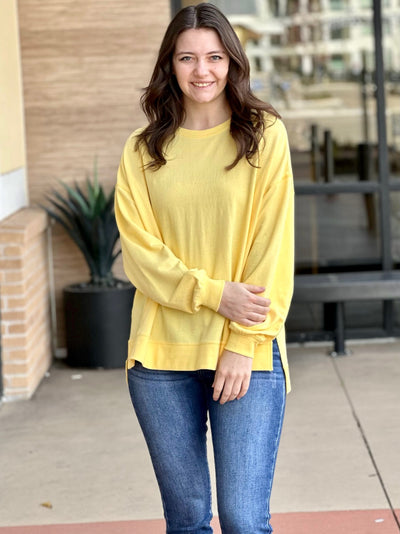 MEGAN IN YELLOW SWEATER CROSSED ARMS