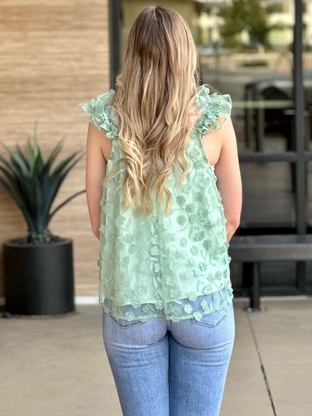 Lexi in floral tank top back view