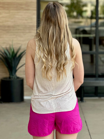 Lexi in oatmeal tank top back view