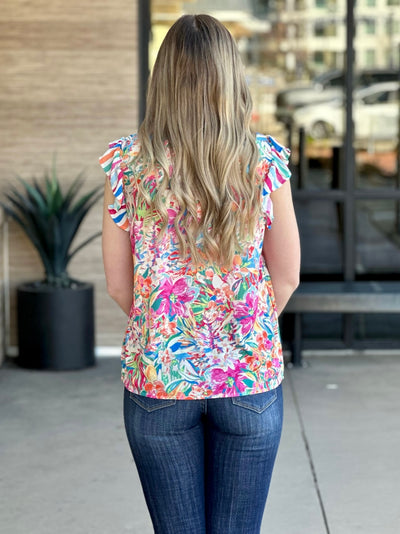 Lexi in pink blue blouse back view