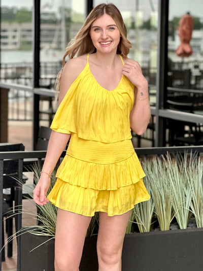 Lexi in yellow romper front view smiling