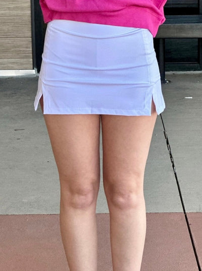 Lexi in white skort front view
