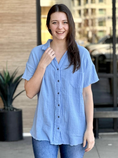 Megan in spring blue shirt front view smiling