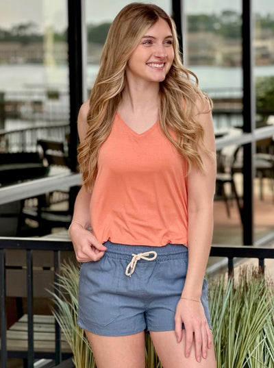 Lexi in creamy peach top front view hand in pocket