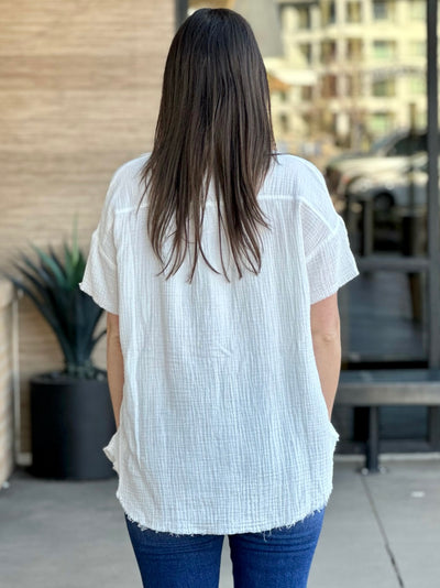 Megan in ivory shirt back view